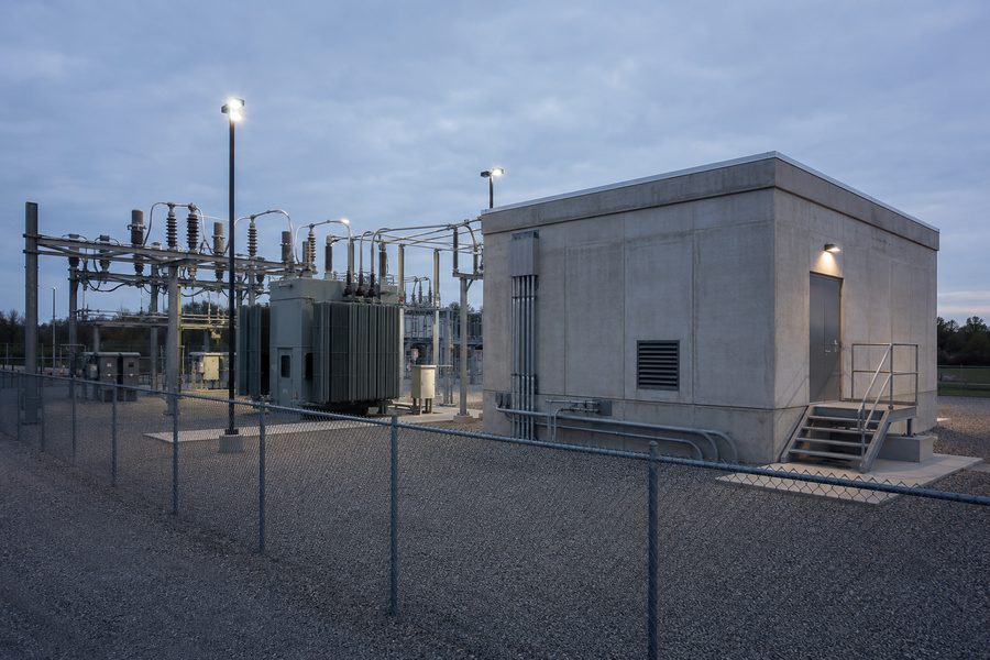 Electrical substation with a hardened concrete equipment enclosure
